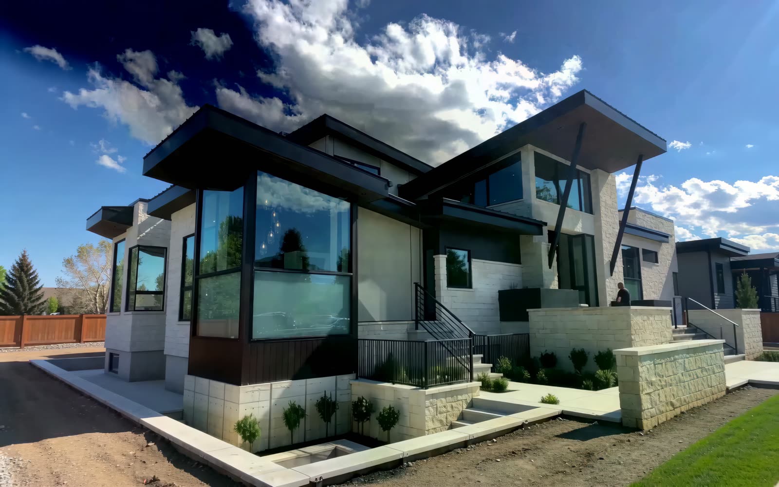 Residence under construction with dark roof planes and glazing being resolved — brand-film visualization