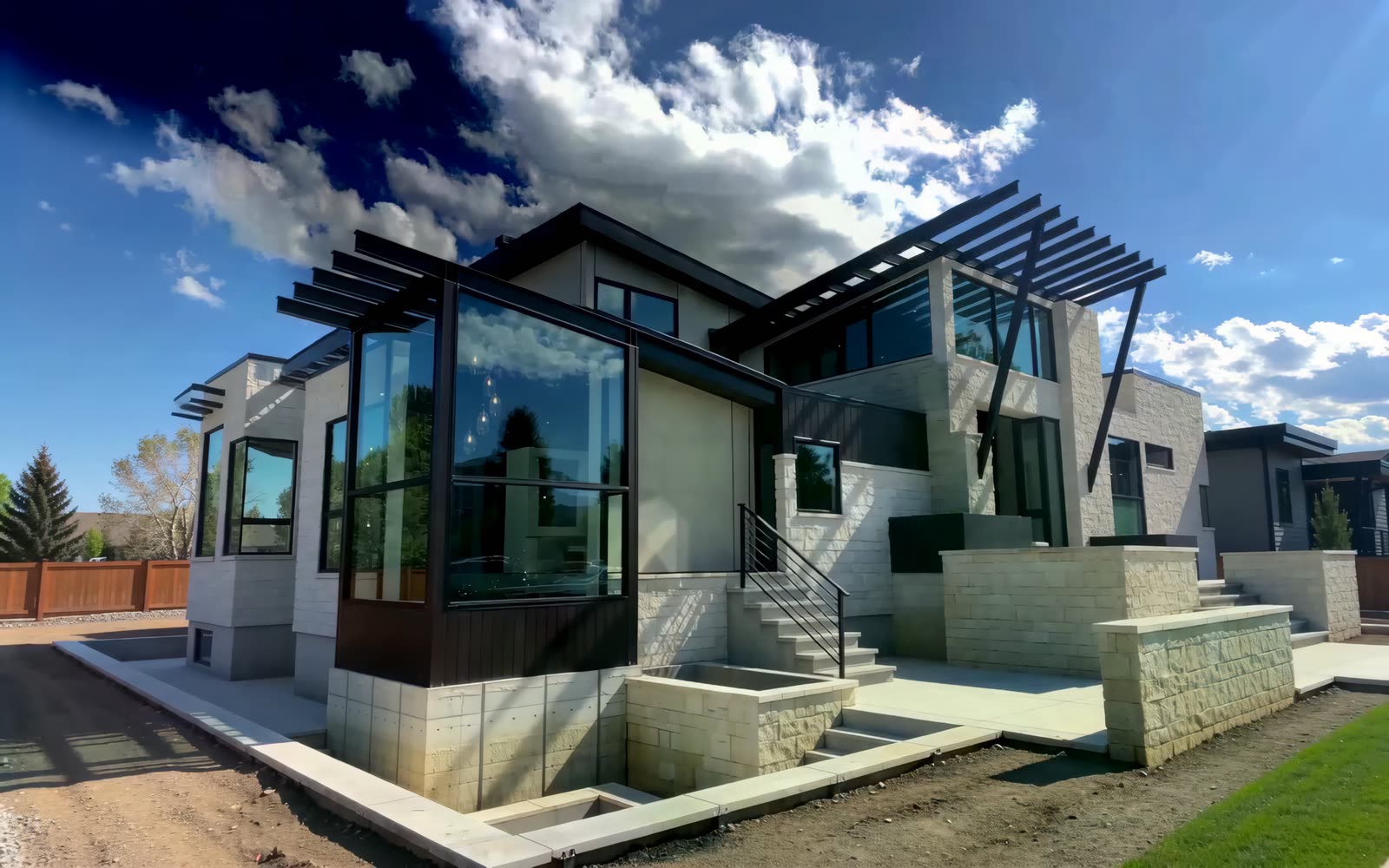 Glazing, stone, and dark paneling being resolved on a residence envelope — brand-film visualization